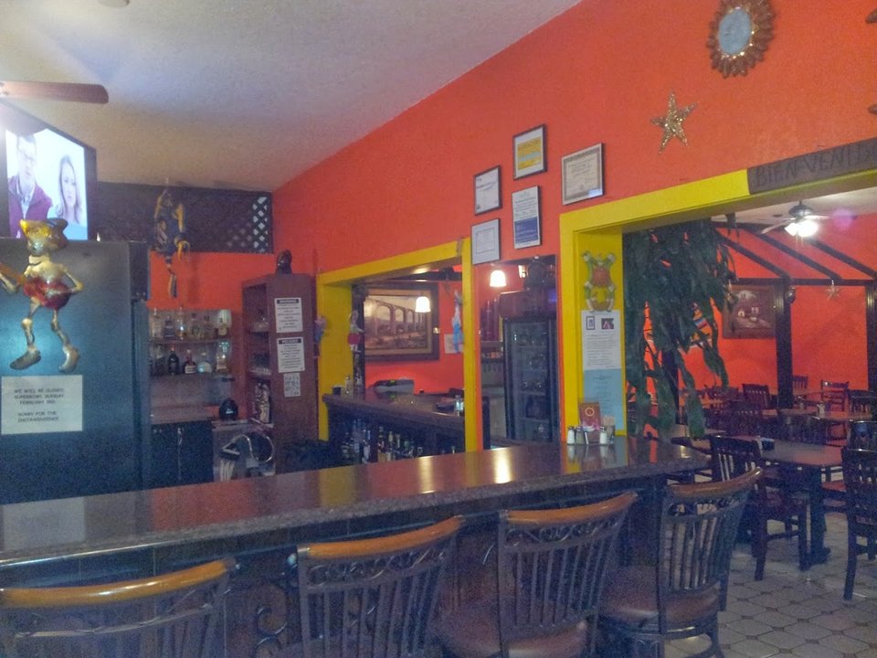 Colorful Mexican plates on a restaurant table.