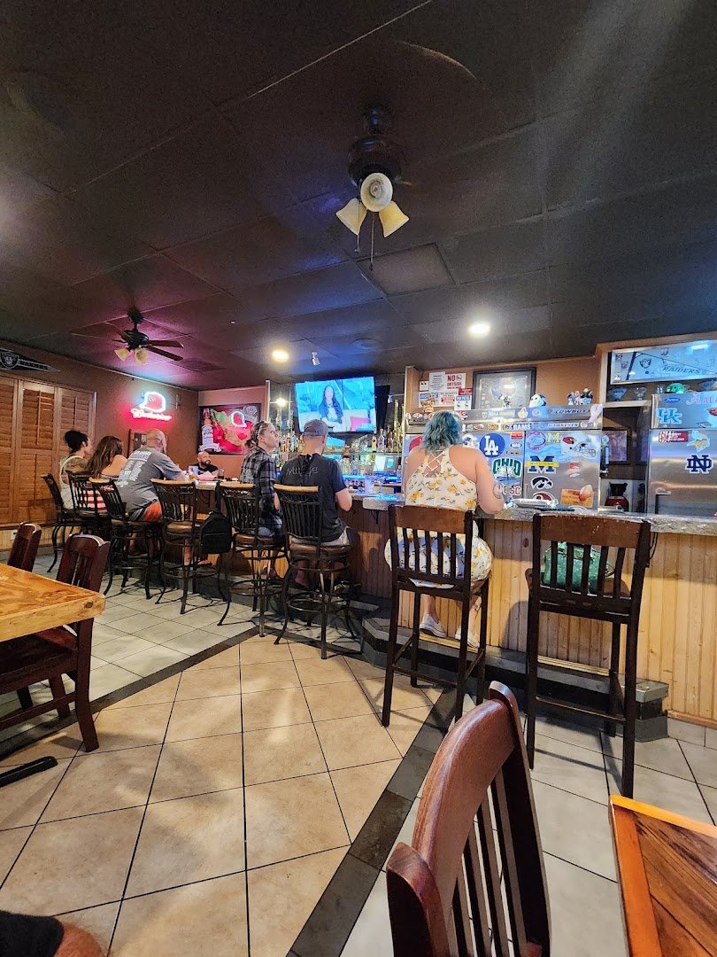 Seafood and Mexican dishes beside a drink menu.